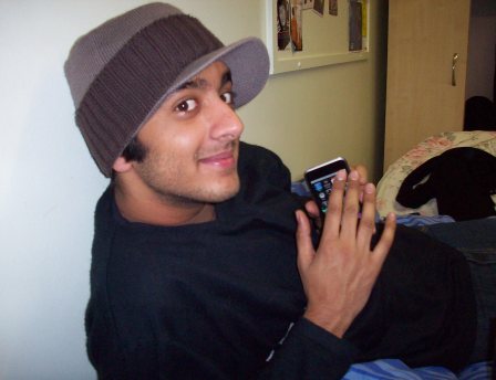 Rishal with his beloved iPod Touch
