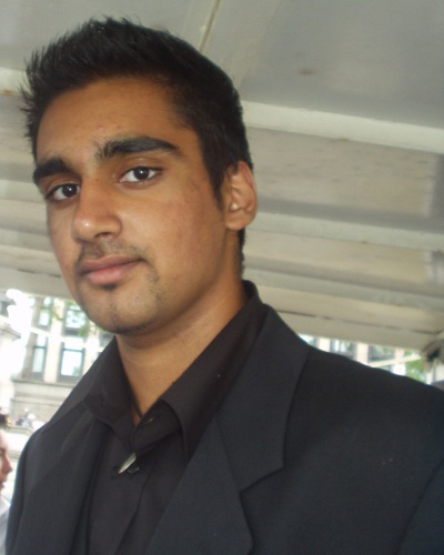 Simranjit, with a specially large photo to show off his sharp suit