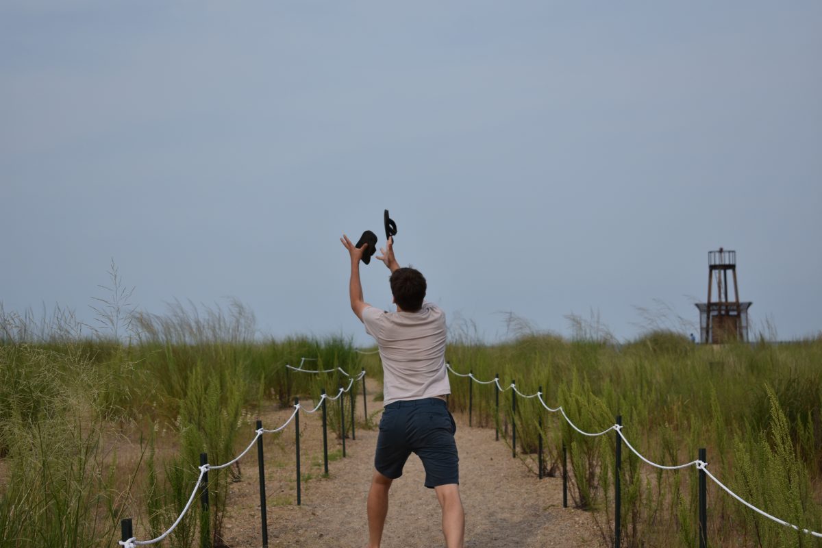 Deftly juggling my flip flops at Loyola Beach