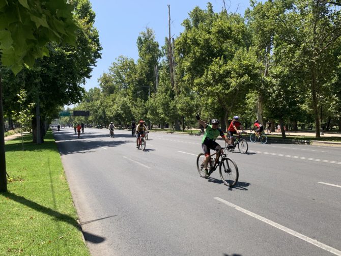A cyclist enjoys the car-free street