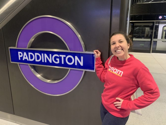 Randi admires the shiny roundel at Paddington